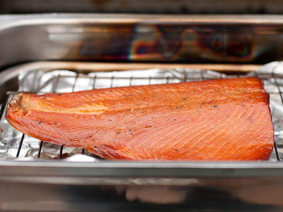Hot smoked salmon sitting in a stovetop smoker.